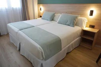 Cama o camas de una habitación en Hotel Don Pepo