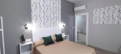 Cama o camas de una habitación en Apartamentos Las trece llaves
