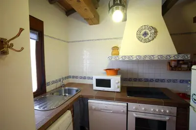 Una cocina o zona de cocina en Casa rural El Leñador