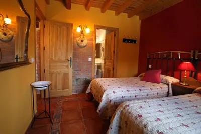 Cama o camas de una habitación en Casa rural El Leñador