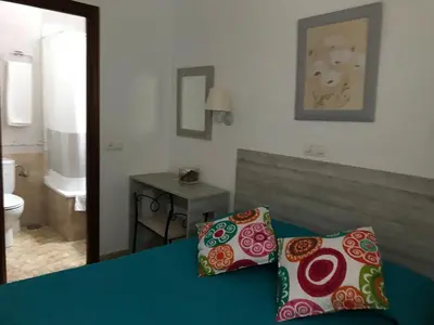 Cama o camas de una habitación en Hostal Argentina EN CACERES
