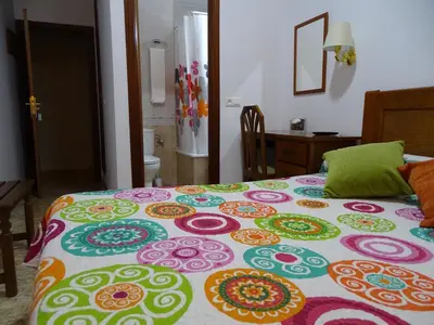 Cama o camas de una habitación en Hostal Argentina EN CACERES