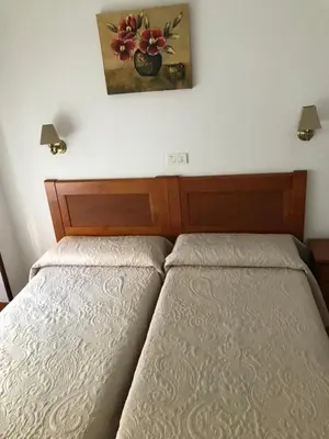 Cama o camas de una habitación en Hostal Argentina EN CACERES