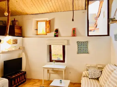 Una televisión o centro de entretenimiento en MaderaVieja - Piscina & Jacuzzi