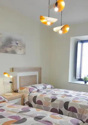 Cama o camas de una habitación en Apartamentos Turísticos Hornillo AT-CC-00681