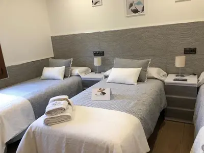Cama o camas de una habitación en El Mirador de Gredos 2