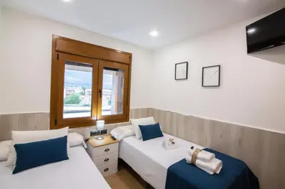 Cama o camas de una habitación en El Mirador de Gredos 1