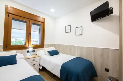 Cama o camas de una habitación en El Mirador de Gredos 1