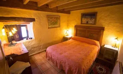 Cama o camas de una habitación en Casa del Cerro es una singular casa rural de fácil acceso