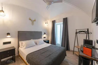 Cama o camas de una habitación en La Posada del Teatro H Boutique Parking Gratis