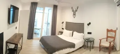 Cama o camas de una habitación en La Posada del Teatro H Boutique Parking Gratis