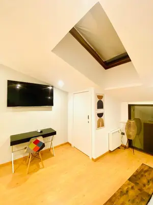 Una televisión o centro de entretenimiento en SUITE SORPRESA VuT LA TABERNA