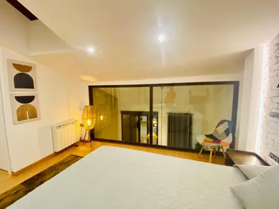 Cama o camas de una habitación en SUITE SORPRESA VuT LA TABERNA