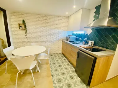 Una cocina o zona de cocina en SUITE SORPRESA VuT LA TABERNA