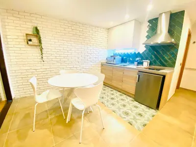 Una cocina o zona de cocina en SUITE SORPRESA VuT LA TABERNA