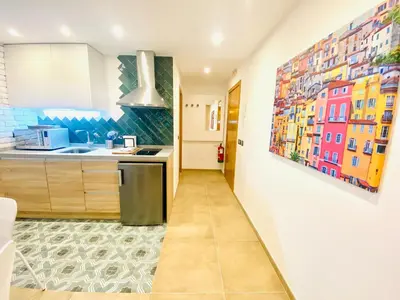 Una cocina o zona de cocina en SUITE SORPRESA VuT LA TABERNA