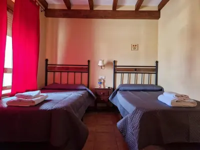 Cama o camas de una habitación en Hostal La Plata