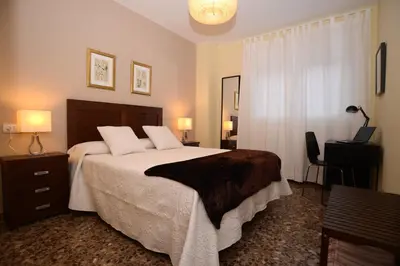 Cama o camas de una habitación en Apartamentos Turísticos Ceres Parking Gratis