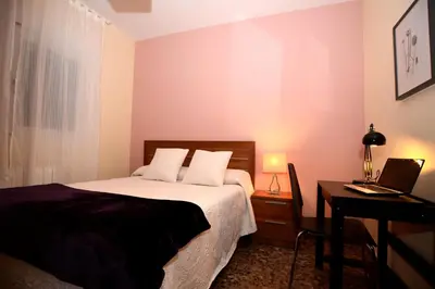 Cama o camas de una habitación en Apartamentos Turísticos Ceres Parking Gratis