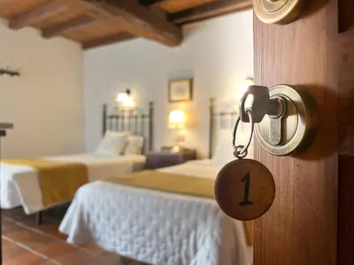 Cama o camas de una habitación en Casa Rural La Fuente del Jerte