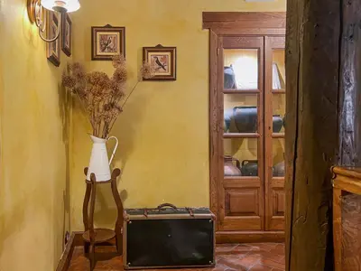 Una televisión o centro de entretenimiento en Casa Rural La Fuente del Jerte