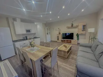 Una cocina o zona de cocina en Apartamentos La Camelia