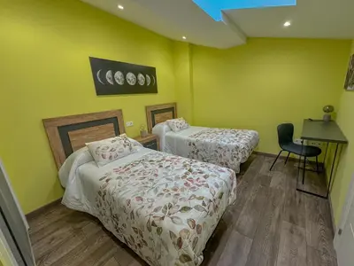Cama o camas de una habitación en Apartamentos La Camelia