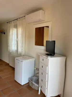 Una televisión o centro de entretenimiento en CASA SEBASTIANA SUITE