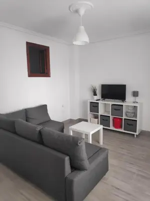 Una televisión o centro de entretenimiento en Apartamento turístico 
