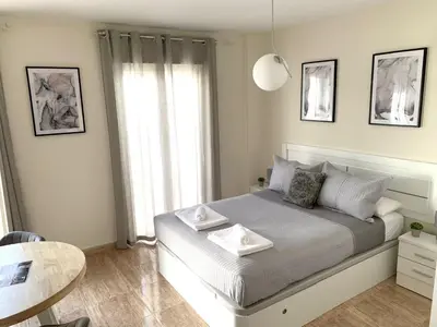 Cama o camas de una habitación en Apartamentos Hernán Cortés
