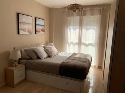 Cama o camas de una habitación en Apartamentos Hernán Cortés
