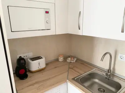 Una cocina o zona de cocina en Apartamentos Hernán Cortés