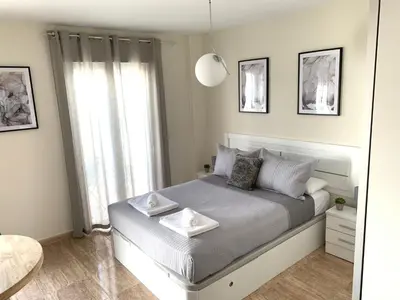 Cama o camas de una habitación en Apartamentos Hernán Cortés