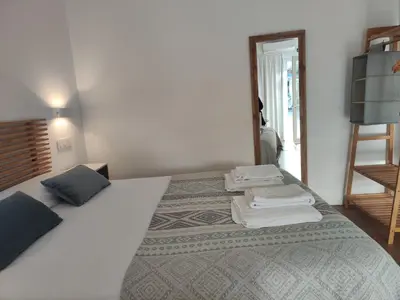 Cama o camas de una habitación en Apartamentos Atenea Jerte