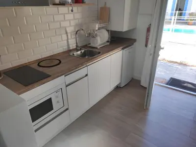 Una cocina o zona de cocina en Apartamentos Atenea Jerte