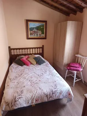 Cama o camas de una habitación en Casa rural TIO PEDRITO