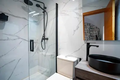 Un baño de Apartamentos Turísticos Cáceres 