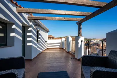 Un balcón o terraza de Apartamentos Turísticos Cáceres 