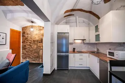 Una cocina o zona de cocina en Apartamentos Turísticos Cáceres 