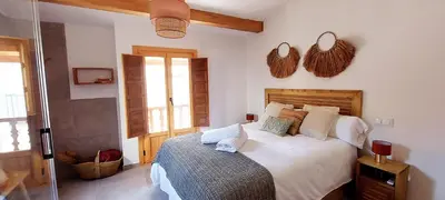 Cama o camas de una habitación en La Grulla Apartamento Rural