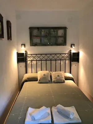 Cama o camas de una habitación en Hostal Fogón de Gredos