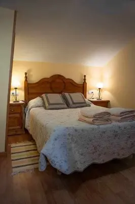 Cama o camas de una habitación en El Nido de Gredos cuco apartamento con chimenea