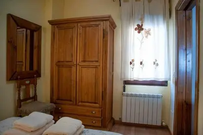 Cama o camas de una habitación en El Nido de Gredos cuco apartamento con chimenea