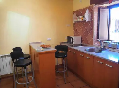Una cocina o zona de cocina en Casa Rural El Guindo