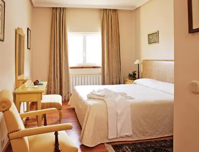 Cama o camas de una habitación en El Milano Real