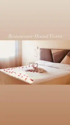 Cama o camas de una habitación en Hotel Tierra