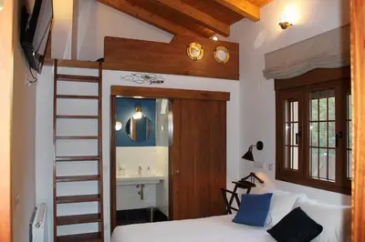 Cama o camas de una habitación en Molino de La Médica - Casa Rural de Lujo en Gredos