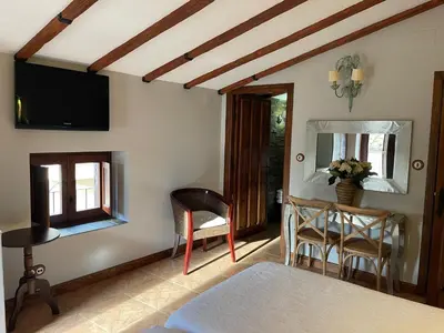 Una televisión o centro de entretenimiento en Apartamento rural jama