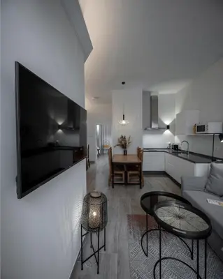 Una televisión o centro de entretenimiento en Apartamentos Rosa Velázquez