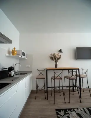Una cocina o zona de cocina en Apartamentos Rosa Velázquez